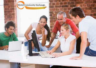  Group of people gathered around a computer
