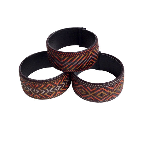 <center>Assorted Earth Tone Caña Flecha Bracelets </br>Crafted by Artisans in Colombia </br>Measure 1” wide with variable diameter</center>