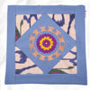 Hand embroidered pillow cover with handwoven ikat silk accents, blue base