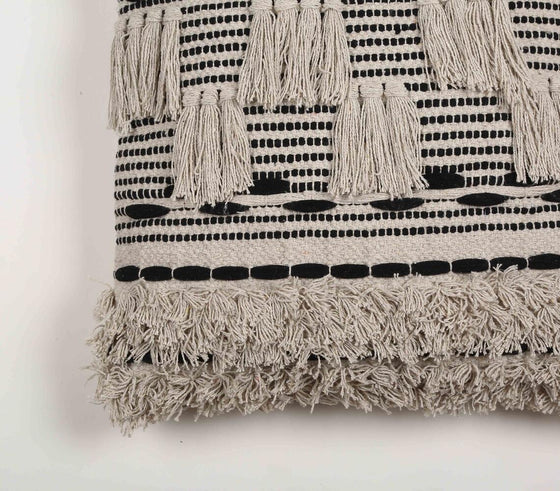 Monochrome cushion cover with tufts & fringes